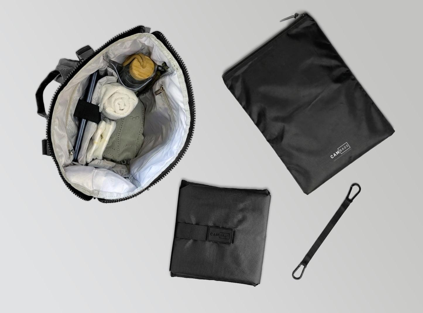 Mochila maternal Cam Bags negra con accesorios